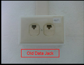 Older data jack with ports labeled for voice and data
